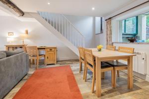 a living room with a table and a couch at 2 Bed in Pooley Bridge oc-r33740 in Pooley Bridge