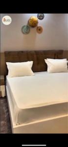 Ένα ή περισσότερα κρεβάτια σε δωμάτιο στο Investia Séjours