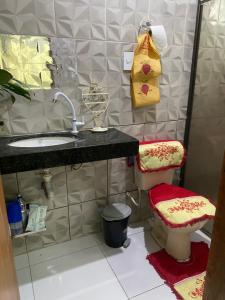 a bathroom with a sink and a toilet at hospedaCOP30Roma in Belém +8 photos