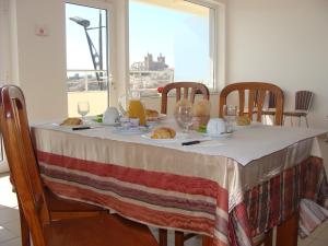 a table with a table cloth with food on it at Pensao Vista Bela in Miranda do Douro