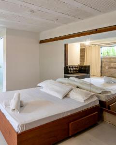 Ένα ή περισσότερα κρεβάτια σε δωμάτιο στο Pousada SáGuest