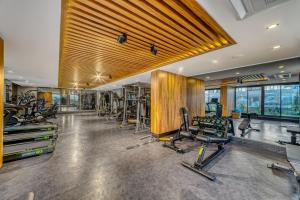 a gym with several treadmills and exercise equipment at 'Ultra Luxury Holiday Apt in the Heart of the City in Alanya