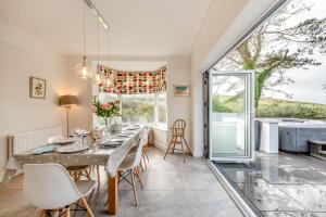 a dining room with a table and chairs at 4 Bed in Woolacombe oc-h33441 in Mortehoe
