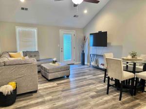 a living room with a couch and a table at Modern 2bd 2ba - Near I75, No Steps, Free Wifi in Richmond