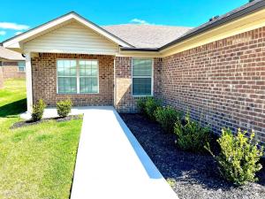 a brick house with a walkway in front of it at Modern 2bd 2ba - Near I75, No Steps, Free Wifi in Richmond