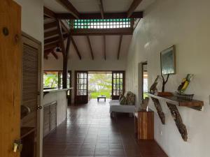a living room with a white couch in a room at Hidden Coast villa Frangipani Ocean & Jungle in Manzanillo