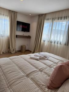 a bed with two towels on it in a bedroom at Modern Studio France ville in Casablanca