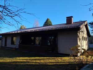 an old house with a window and a roof at NorthSlope in Rovaniemi