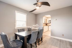a dining room with a table and chairs at 3 Bedroom home near DC in Oxon Hill +38 photos
