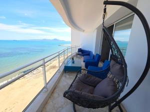 a hammock on a balcony overlooking the beach at La perle bleue in La Goulette