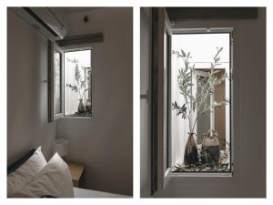 a bedroom with a window with a plant in it at Domus Mare in Peñíscola +15 photos