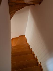 a staircase in a house with wooden floors at Symphony Home in Pergine Valsugana