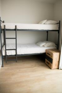 Postel nebo postele na pokoji v ubytování Suite Vuurtoren Zeeland