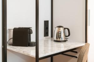 a appliance sitting on a counter in a room at Limehome Benidorm Calle Mayor in Benidorm