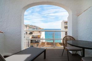 a balcony with a view of the ocean at Limehome Benidorm Calle Mayor in Benidorm