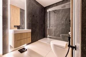 a bathroom with a toilet and a shower at Charming & Luxurious Suite Garibaldi BIG - Fully equipped & renovated - Old Town in Olbia