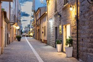 an empty street in an old town at night at Charming & Luxurious Suite Garibaldi BIG - Fully equipped & renovated - Old Town in Olbia