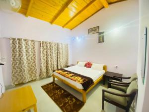 Ένα ή περισσότερα κρεβάτια σε δωμάτιο στο Ramda Guest House