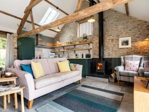 a living room with a couch and a fireplace at 1 Bed in Combe Martin 75476 in Kentisbury +25 photos