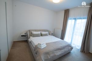 Ένα ή περισσότερα κρεβάτια σε δωμάτιο στο Milan Luxury Apartaments III-Brasov#near Coresi