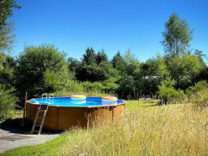 a hot tub in the middle of a field at Le Ranch Camping et Glamping in Madranges