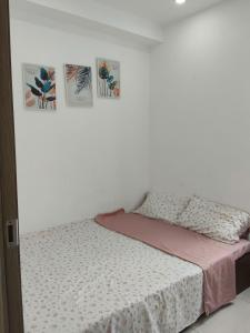 Ένα ή περισσότερα κρεβάτια σε δωμάτιο στο Homestay Nera Graden Hue - Nghỉ dưỡng cao cấp Huế +6 φωτογραφίες