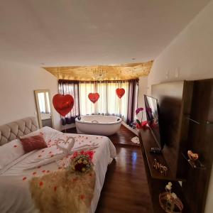 Ένα ή περισσότερα κρεβάτια σε δωμάτιο στο Pousada Recanto dos Moinhos - Panorâmica