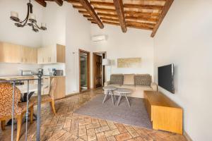 TV a/nebo společenská místnost v ubytování Palazzo Catalani Resort