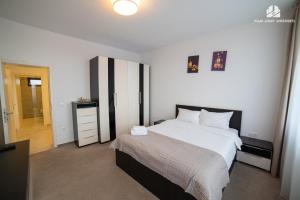 Ένα ή περισσότερα κρεβάτια σε δωμάτιο στο Milan Luxury Studio VI-Brașov#near Coresi Mall