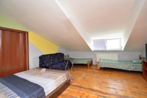 Ένα ή περισσότερα κρεβάτια σε δωμάτιο στο Yerevan Rooms Guest House