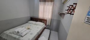 Postel nebo postele na pokoji v ubytování Residencial Portal da Praia