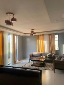 a living room with a couch and a table at Kantona estates in Kigali