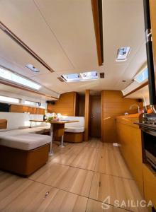 a kitchen and living room of a boat at Unique Yacht Stay Near Historic Valletta in Tal-Pietà