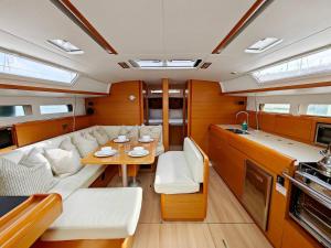 a living room with a couch and a table at Unique Yacht Stay Near Historic Valletta in Tal-Pietà +33 photos