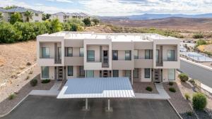 an aerial view of a house with a parking lot at New 4 bed 3 and half bath with pool, hot tub, waterslide and PS5 in Saint George Municipal Airport