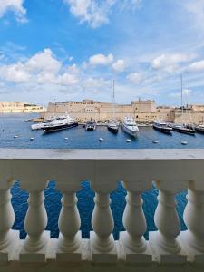 a view of a marina with boats in the water at Harbour Lights in Senglea
