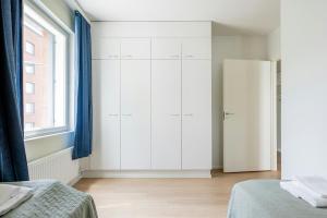 Ένα ή περισσότερα κρεβάτια σε δωμάτιο στο Spacious Apartment for 4 with Sauna