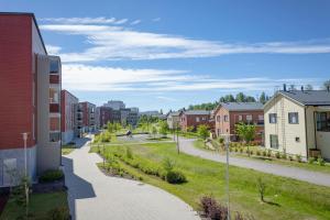 a street in a residential neighborhood with houses at Convenient Apartment for 3 in Masala