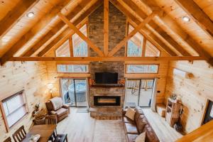 an overhead view of a living room with a fireplace at The Lazy Maple in Red River Gorge in Rogers