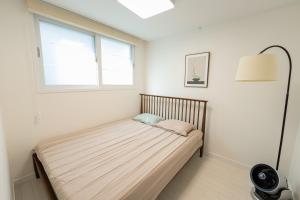 Giường trong phòng chung tại Greenery SEOUL