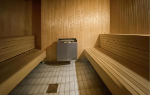 a sauna with a trash can in the middle at Lovely Home In Byxelkrok With Sauna in Byxelkrok