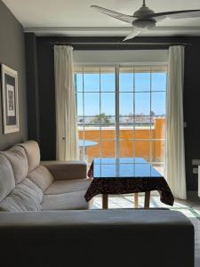 a living room with a couch and a table at Signature Stay Apartments 6 in Almuñécar