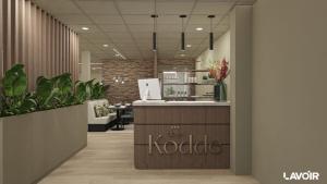 an office with a reception desk and some plants at Hotel Kodde in Aagtekerke