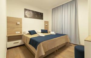 Postel nebo postele na pokoji v ubytování Beautiful Home In Privlaka