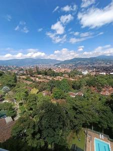 an aerial view of a city with buildings and trees at City views Air-conditioning Heated pool in Envigado