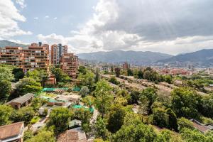 an aerial view of a city with buildings and trees at City views Air-conditioning Heated pool in Envigado