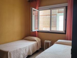 Postel nebo postele na pokoji v ubytování CHL Mayoysa, La Palma Breña Baja