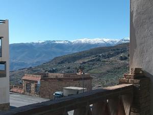 a view of the mountains from the balcony of a building at Loft Ohanes in Ohanes