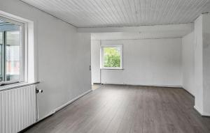 an empty room with a window and a white wall at 1 Bedroom Nice Home In Hurup Thy in Ullerup
