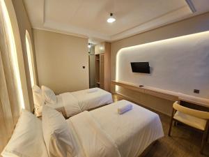 TV a/nebo společenská místnost v ubytování Tamashii Boutique Hotel